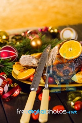 Christmas Baked Duck Served With Potatoes, Orange And Tomatoes Stock Photo