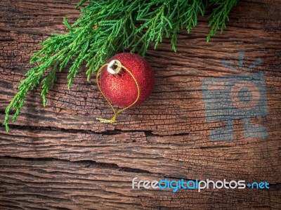 Christmas Fir Tree With Decoration On Dark Wooden Board Stock Photo