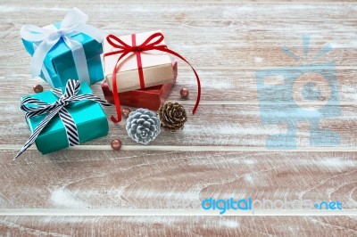 Christmas Gift Box On Wooden Table With Space Stock Photo