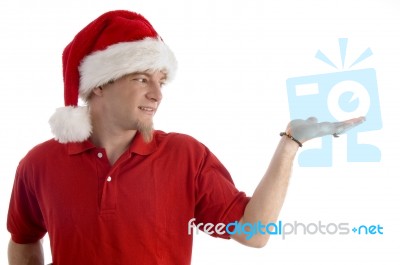 Christmas Hat Wearing Male Looking At Palm Stock Photo