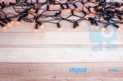 Christmas Lights,garland Lights On Wooden Background Stock Photo