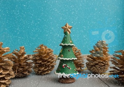 Christmas Ornament With Christmas Tree And Pine Cone In Snow Stock Photo