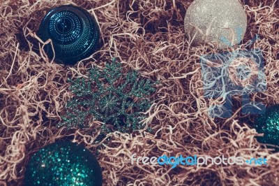 Christmas Ornaments In Hay Stock Photo