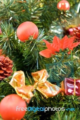 Christmas Tree Decorated With Red Balls And Gifts Stock Photo