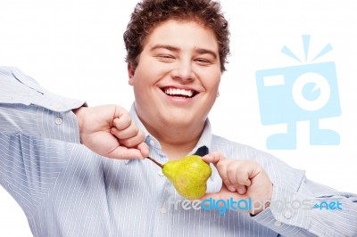 Chubby Boy And Pear Stock Photo