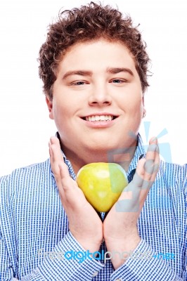 Chubby Man Holding Apple Stock Photo