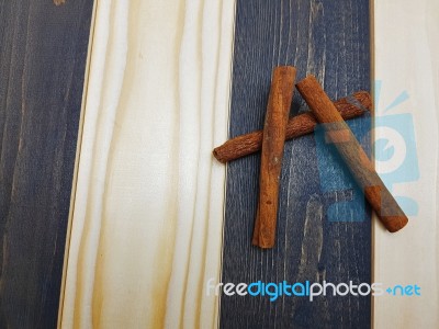 Cinnamon On The Wooden Board Stock Photo