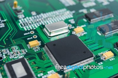 Circuit Board With Electronic Components Background Stock Photo