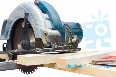 Circular Saw Cutting Wood And Iron Ruler Stock Photo