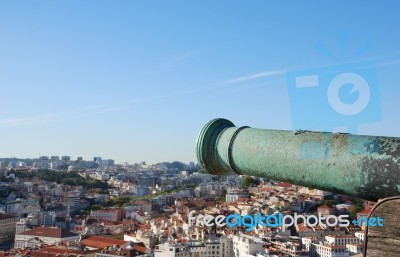 Cityscape Of Lisbon In Portugal With Cannon Weapon Stock Photo