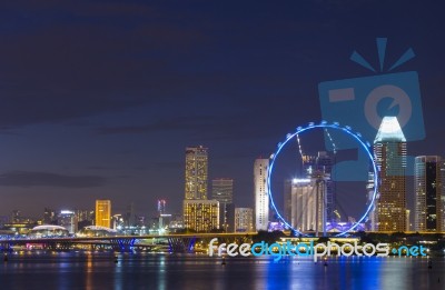 Cityscape View And Ferris Wheel Landmark Of Singapore Stock Photo