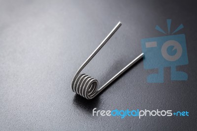 Clapton Coil For Vaping On A Black Background Stock Photo