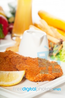 Classic Milanese Veal Cutlets And Vegetables Stock Photo