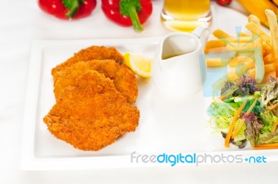 Classic Milanese Veal Cutlets And Vegetables Stock Photo