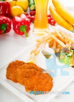 Classic Milanese Veal Cutlets And Vegetables Stock Photo