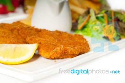 Classic Milanese Veal Cutlets And Vegetables Stock Photo