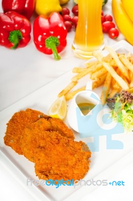 Classic Milanese Veal Cutlets And Vegetables Stock Photo