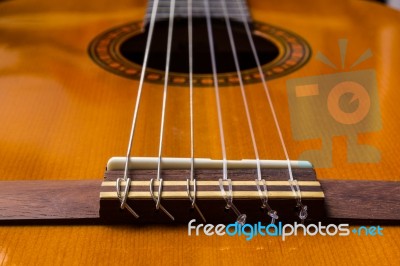 Classical Guitar And Strings And The Bridge Stock Photo