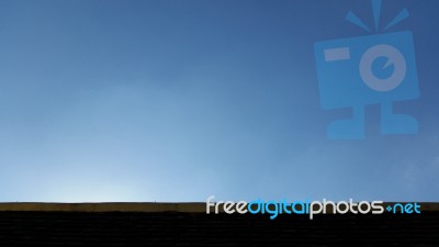 Clear Blue Sky Over Roof Top Stock Photo