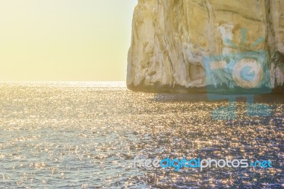 Clear Water Sea With Rocky Coastline Stock Photo