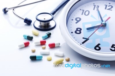 Clock With Medicine Stock Photo