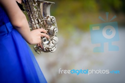 Close Up Beautiful Woman Wear Blue Evening Dress Sound Saxophone… Stock Photo