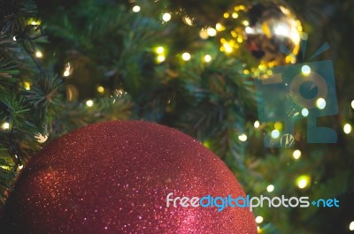 Close Up Big Red Glitter Ball Christmas On Tree With Wire White Light Background Stock Photo