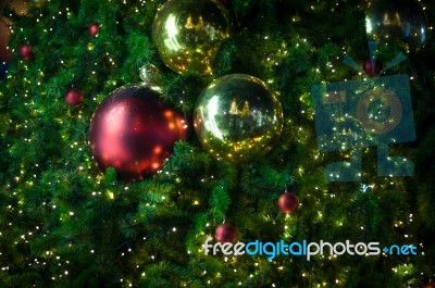 Close Up Big Red Glitter Ball Christmas On Tree With Wire White Light Background Stock Photo