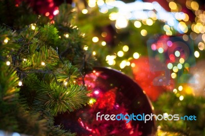 Close Up Big Red Glitter Ball Christmas On Tree With Wire White Light Background Stock Photo