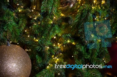 Close Up Big Red Glitter Ball Christmas On Tree With Wire White Light Background Stock Photo