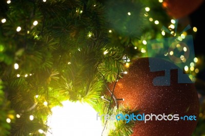 Close Up Big Red Glitter Ball Christmas On Tree With Wire White Light Background Stock Photo