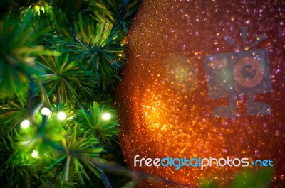 Close Up Big Red Glitter Ball Christmas On Tree With Wire White Light Background Stock Photo