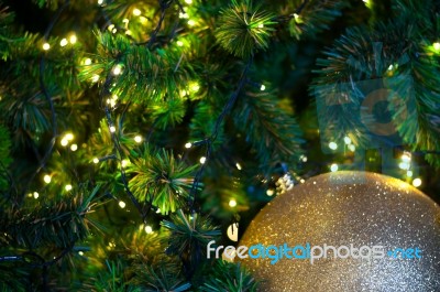 Close Up Big Yellow Glitter Ball Christmas On Tree With Wire White Light Background Stock Photo