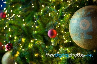 Close Up Big Yellow Glitter Ball Christmas On Tree With Wire White Light Background Stock Photo