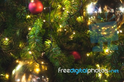 Close Up Big Yellow Glitter Ball Christmas On Tree With Wire White Light Background Stock Photo