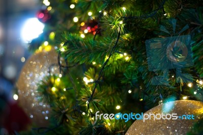 Close Up Big Yellow Glitter Ball Christmas On Tree With Wire White Light Background Stock Photo