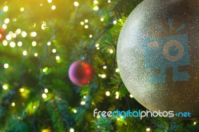 Close Up Big Yellow Glitter Ball Christmas On Tree With Wire White Light Background Stock Photo