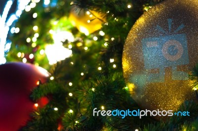 Close Up Big Yellow Glitter Ball Christmas On Tree With Wire White Light Background Stock Photo