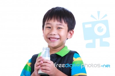 Close Up Boy Smiling And Holding Bottle Of Milk, On White Stock Photo