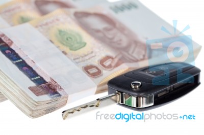 Close Up Car Key And Stacks Of Money Thai Baht Stock Photo