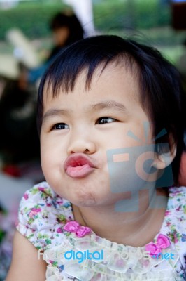 Close Up Face Of Lovely And Cute Asian Baby Making Funny Mouth Stock Photo