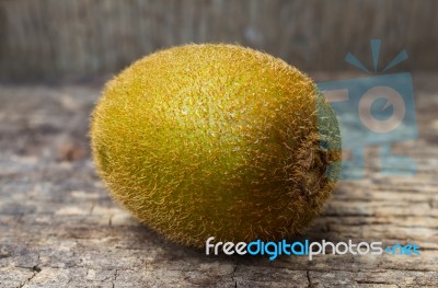 Close Up Fresh Kiwi Fruit On Old Wood Background Stock Photo