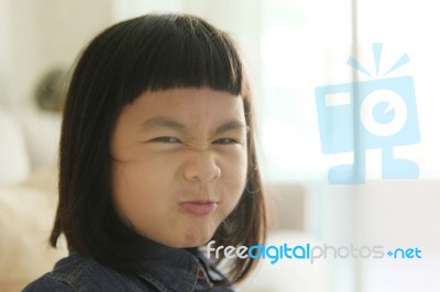 Close Up Funny Face Of Asian Children Playing In Family With Happiness Emotion Stock Photo