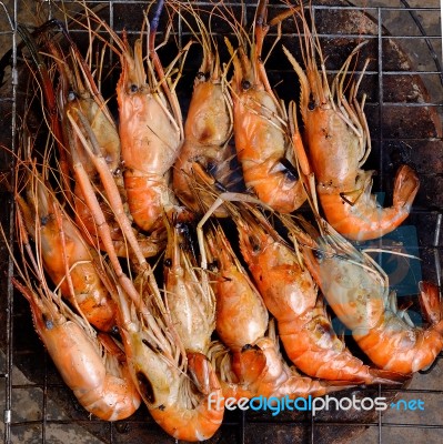 Close Up Grilled Shrimp With Flames Stock Photo