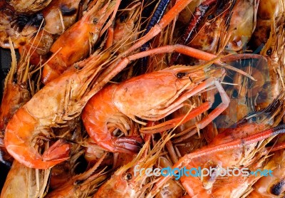 Close Up Grilled Shrimp With Flames Stock Photo