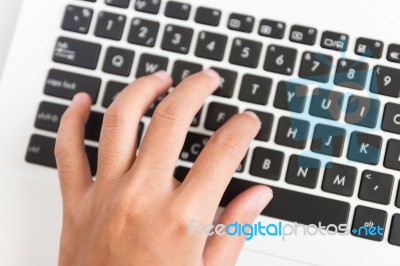 Close Up Hand Type On Laptop Keyboard Stock Photo