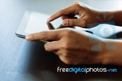 Close-up Hand Using Tablet, Selective Focus Finger Touching On T… Stock Photo