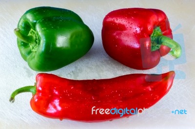 Close-up Macro Shot Of Red And Green Capiscums And A Cayenne Pep… Stock Photo