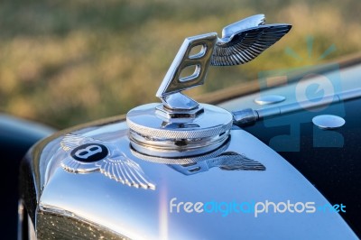 Close-up Of A Bentley Emblem Stock Photo