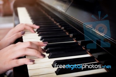 Close-up Of A Music Performer's Hand Playing The Piano Stock Photo